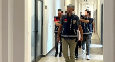 Kucağında çocukla adliyeye getirildi 