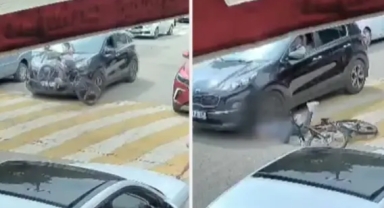 Otomobilin altında kalan çocuk feci şekilde can verdi